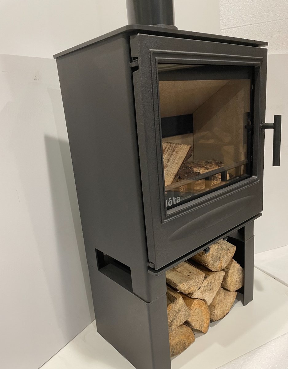 Belina stove on its matching log store, three-quarter view